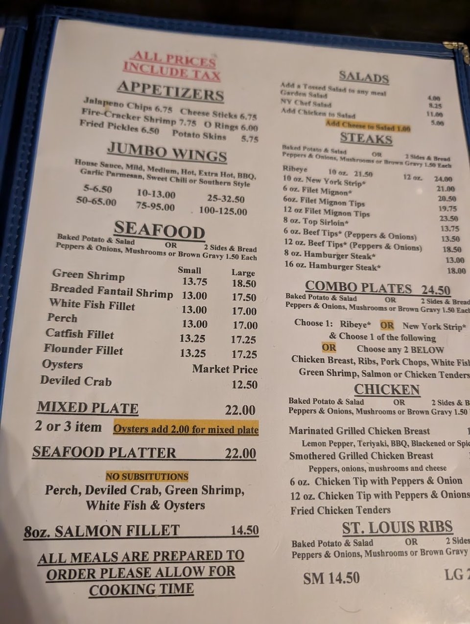 Plated steak and seafood dishes.